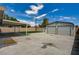 View of the backyard with a large detached garage and covered parking at 108 Prince Ln, Las Vegas, NV 89110