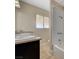 The full bath area features an updated vanity, a large mirror and a tub-shower combination at 108 Prince Ln, Las Vegas, NV 89110