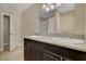 A double sink vanity with modern fixtures and a framed mirror highlights this clean and efficient bathroom at 108 Prince Ln, Las Vegas, NV 89110