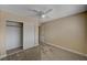 This cozy bedroom offers carpet flooring, neutral walls, and a closet with sliding doors at 108 Prince Ln, Las Vegas, NV 89110