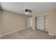 Neutral tones, plush carpet, a modern fan, and a large closet are the highlights of this bedroom at 108 Prince Ln, Las Vegas, NV 89110