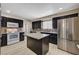 Updated kitchen with modern appliances, granite countertops, and dark wood cabinetry at 108 Prince Ln, Las Vegas, NV 89110
