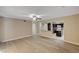 Open-concept living room with wood flooring, offering seamless flow to the kitchen area at 108 Prince Ln, Las Vegas, NV 89110
