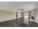 Bright living room with a stone fireplace, wood floors, ceiling fan, and sliding glass doors at 108 Prince Ln, Las Vegas, NV 89110