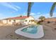 Home exterior with refreshing pool, desert landscaping, and covered patio at 116 Crescent Bay St, Henderson, NV 89012