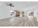 Bright and open living room features modern flooring, recessed lighting, and a ceiling fan at 116 Crescent Bay St, Henderson, NV 89012