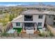 This backyard boasts a relaxing hot tub and pergola with a cozy outdoor seating area at 12355 Grey Dunes Ave, Las Vegas, NV 89138