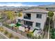 Enjoy outdoor living in this backyard with a hot tub, shaded pergola lounge, and lush plants at 12355 Grey Dunes Ave, Las Vegas, NV 89138