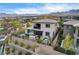Gorgeous backyard featuring a lounge area under a pergola, a hot tub, and landscaped details at 12355 Grey Dunes Ave, Las Vegas, NV 89138