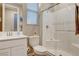 Bathroom featuring a single sink vanity, a glass enclosed shower, and a large window at 12355 Grey Dunes Ave, Las Vegas, NV 89138