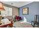 Bright office space with natural light, neutral carpet, and vibrant wall decor at 12355 Grey Dunes Ave, Las Vegas, NV 89138
