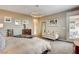 Cozy main bedroom with sitting area, plush carpeting, and access to outdoor patio space at 12355 Grey Dunes Ave, Las Vegas, NV 89138