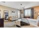Bright main bedroom with large window, sitting area, plush carpeting, and ample natural light at 12355 Grey Dunes Ave, Las Vegas, NV 89138