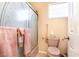 Compact bathroom features a matching pink toilet and towels at 1259 N Hollywood Blvd, Las Vegas, NV 89110