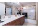 Bathroom featuring double sinks, tile flooring, and a shower-tub combo at 1259 N Hollywood Blvd, Las Vegas, NV 89110