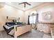 Bedroom features a ceiling fan, large windows, and carpeted floors at 1259 N Hollywood Blvd, Las Vegas, NV 89110