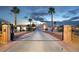 Gated estate home with long driveway and desert landscaping under a dusky sky at 1259 N Hollywood Blvd, Las Vegas, NV 89110