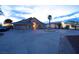 Expansive driveway and elegant front yard with mature palm tree at 1259 N Hollywood Blvd, Las Vegas, NV 89110