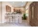 Inviting kitchenette with an eating bar, cabinetry and natural light from the front door window at 1259 N Hollywood Blvd, Las Vegas, NV 89110