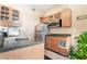 Functional kitchenette with light wood cabinets, a microwave, and refrigerator at 1259 N Hollywood Blvd, Las Vegas, NV 89110