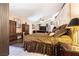 Expansive main bedroom featuring elegant furnishings, a ceiling fan, and entertainment center at 1259 N Hollywood Blvd, Las Vegas, NV 89110