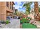Large backyard with patio, outdoor kitchen, and putting green for entertainment at 1272 Olivia Pkwy, Henderson, NV 89011