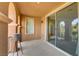 Balcony with view inside and outside, featuring arched columns and a neutral color palette at 1272 Olivia Pkwy, Henderson, NV 89011