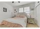 Charming bedroom with soft pink accents, plush bedding, and stylish window shutters at 1272 Olivia Pkwy, Henderson, NV 89011