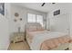 Charming bedroom featuring a cozy bed, stylish lamps, and soft carpet flooring at 1272 Olivia Pkwy, Henderson, NV 89011