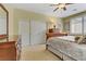 Bedroom showcasing large closet, wood furnishings, and neutral color scheme at 1272 Olivia Pkwy, Henderson, NV 89011