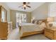 Cozy bedroom with natural light, plush carpeting, and a sliding glass door to the backyard at 1272 Olivia Pkwy, Henderson, NV 89011