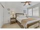 Cozy bedroom featuring a comfortable bed, stylish lamps, and soft carpet flooring at 1272 Olivia Pkwy, Henderson, NV 89011