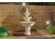 Multi-tiered fountain adding a touch of elegance to the outdoor living space at 1272 Olivia Pkwy, Henderson, NV 89011