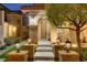 Inviting home entrance with a solid wood door, stone accents, and meticulously landscaped front yard at 1272 Olivia Pkwy, Henderson, NV 89011