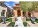 Inviting two-story home with decorative brick pillars and a well-maintained lawn at 1272 Olivia Pkwy, Henderson, NV 89011
