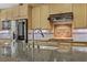 Modern kitchen featuring stainless steel appliances, a granite countertop, and custom backsplash at 1272 Olivia Pkwy, Henderson, NV 89011