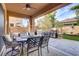 Inviting outdoor patio with a dining area, built-in grill, and covered seating at 1272 Olivia Pkwy, Henderson, NV 89011