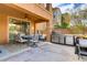 Inviting covered patio features dining set and built-in BBQ, perfect for outdoor entertaining at 1272 Olivia Pkwy, Henderson, NV 89011
