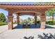 Inviting shaded picnic area with stone columns offering a serene outdoor dining experience at 1272 Olivia Pkwy, Henderson, NV 89011