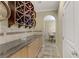 Elegant wine cellar features custom racking and a granite countertop, perfect for wine enthusiasts at 1272 Olivia Pkwy, Henderson, NV 89011
