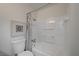 Clean bathroom features a white tub, shower combo and modern fixtures at 1450 Fern St, Pahrump, NV 89060