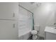 Bathroom featuring shower-tub combo with white cabinets and modern fixtures at 1450 Fern St, Pahrump, NV 89060