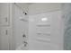Shower-tub combo features grab bars for safety with a tiled showerhead at 1450 Fern St, Pahrump, NV 89060