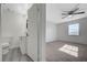 Bathroom view into bedroom highlighting modern vanity and bedroom space at 1450 Fern St, Pahrump, NV 89060