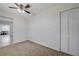 Bedroom with neutral carpet, closet and ceiling fan at 1450 Fern St, Pahrump, NV 89060