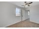 Bedroom with a ceiling fan and window providing natural light at 1450 Fern St, Pahrump, NV 89060