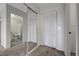 Bedroom area featuring mirrored closet, closet and glimpse into attached bathroom at 1450 Fern St, Pahrump, NV 89060