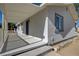 Inviting covered porch featuring a gray exterior, shaded comfort, and protection from weather at 1450 Fern St, Pahrump, NV 89060