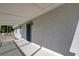 Covered porch, gray exterior, and shaded entry create an inviting welcome at 1450 Fern St, Pahrump, NV 89060