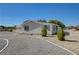 Charming single-story house surrounded by a gravel driveway and desert landscaping at 1450 Fern St, Pahrump, NV 89060